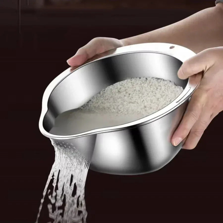 Stainless steel bowl with rice being poured out against a dark background

