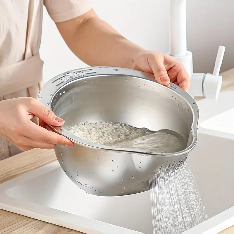 Person rinsing rice in a metal colander over a sink

