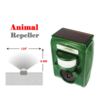 Green animal repeller with solar panel on a white background

