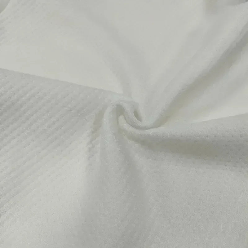 Close-up of white fabric with a subtle texture

