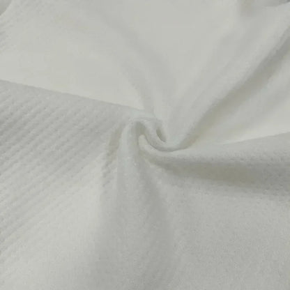 Close-up of white fabric with a subtle texture

