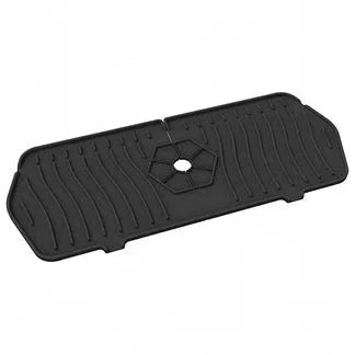 Black rubber mat with a central hole on a white background

