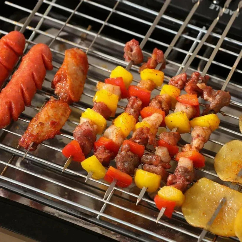 Skewers with meat and vegetables on a grill

