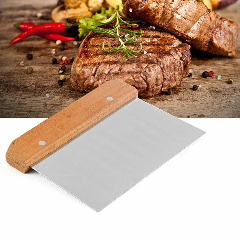 Meat slicer with wooden handle and metal blade on a white background, with cooked meat and vegetables in the background.

