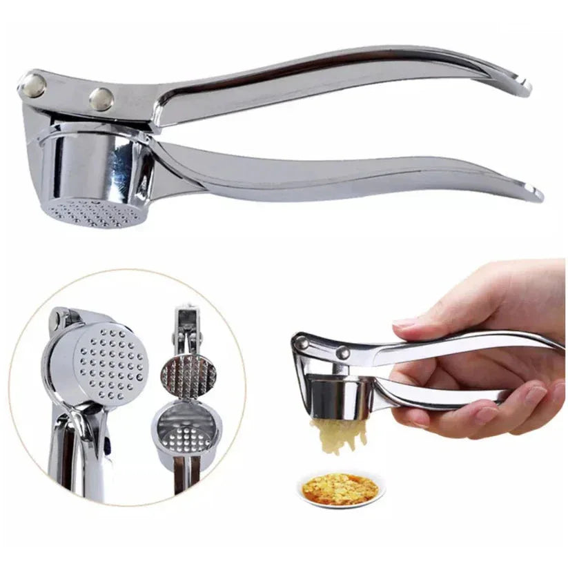 Metal garlic press with a hand holding it, showing minced garlic on a white background.

