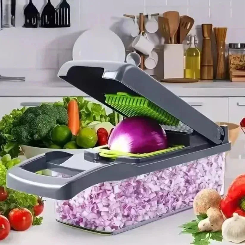 Vegetable chopper with chopped onions on a kitchen counter surrounded by fresh vegetables.

