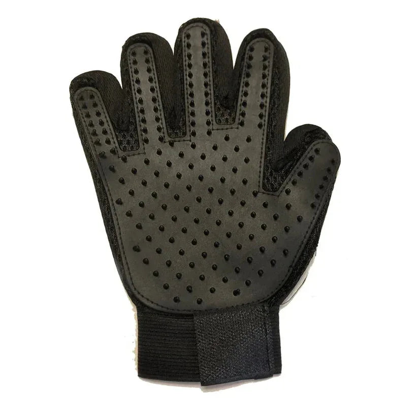 Black grooming glove with textured surface on a white background

