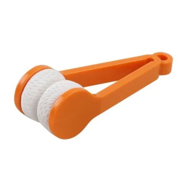 Orange kitchen tongs with a white roller on a white background

