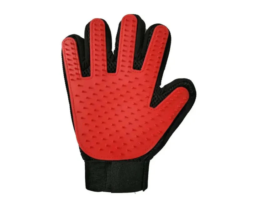 Red grooming glove with black accents on a white background


